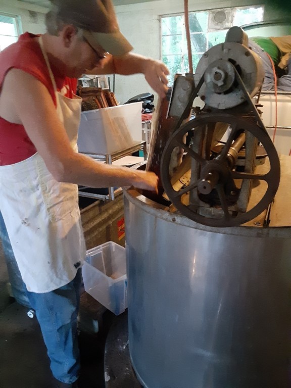 Iona’s grandson, Gregg Wheeler, extracting honey.