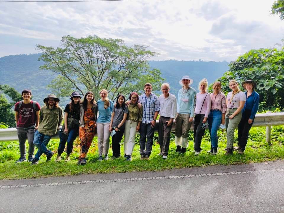 Figure 4. Students in the Beekeeping in Thailand study abroad program standing in front of a large tree filled with Apis dorsata nests. Photo: Sanchai Naree, Burapha University