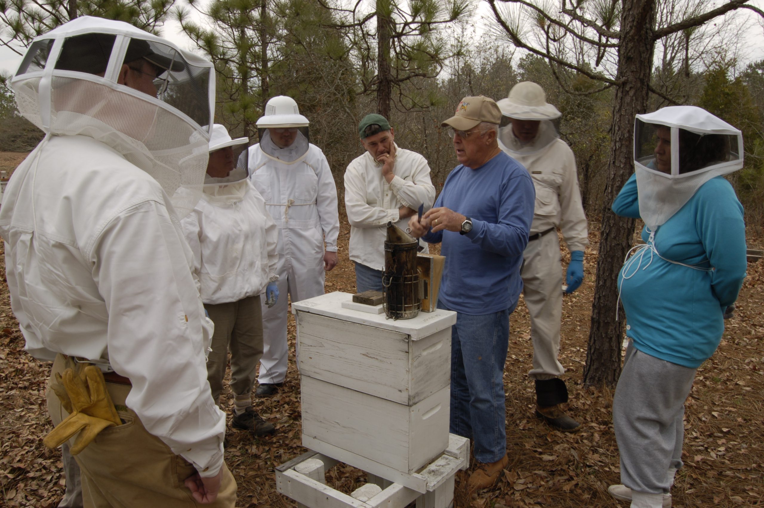 Hugh is wearing the blue shirt. Pictures were 
taken during a hands-on part of the Beginners Beekeeping Course that Hugh teaches at 
Sandhills Community College in Pinehurst, NC with Billy helping with the in-apiary training.