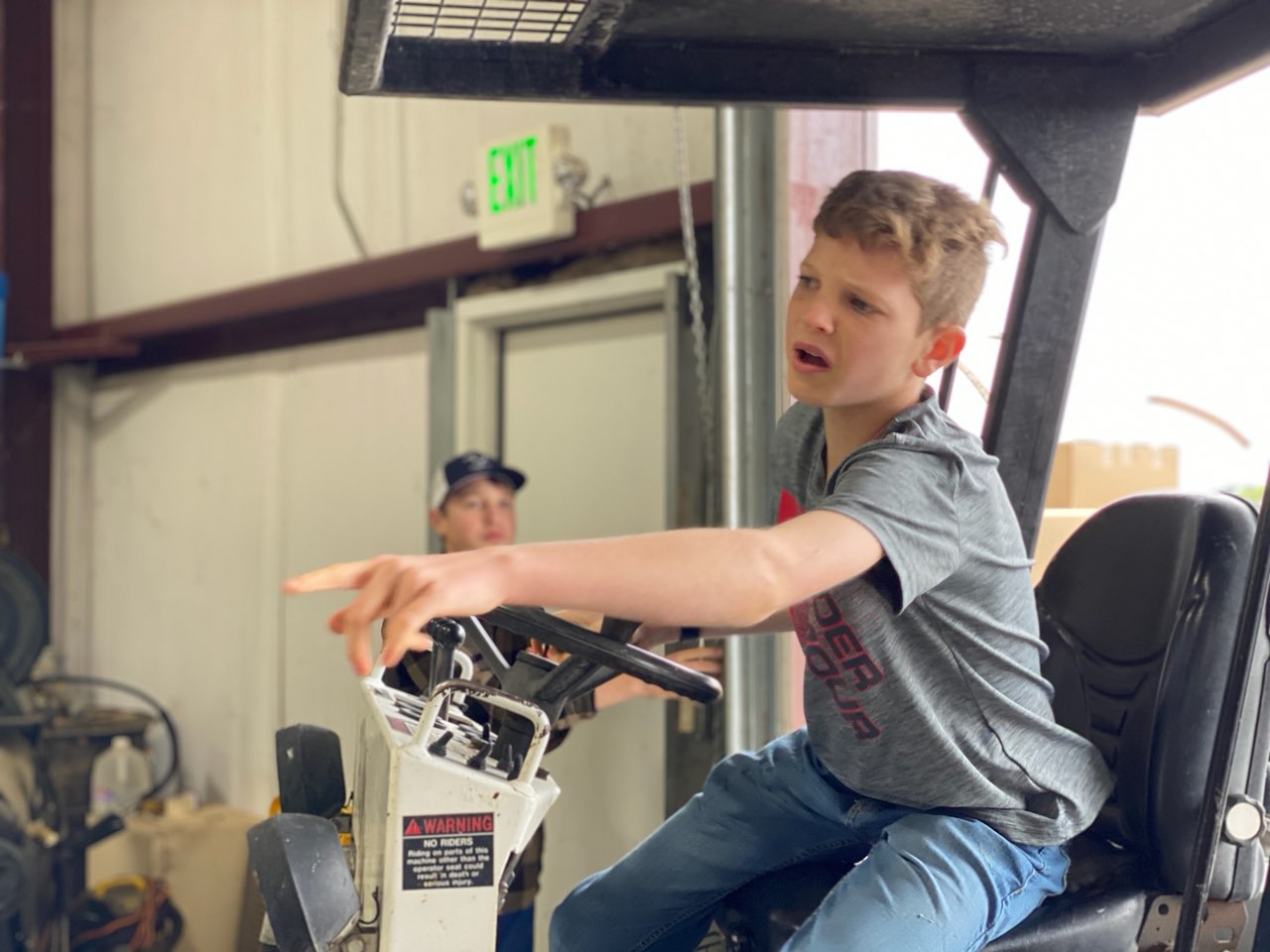 Bryce Landon driving the forklift.