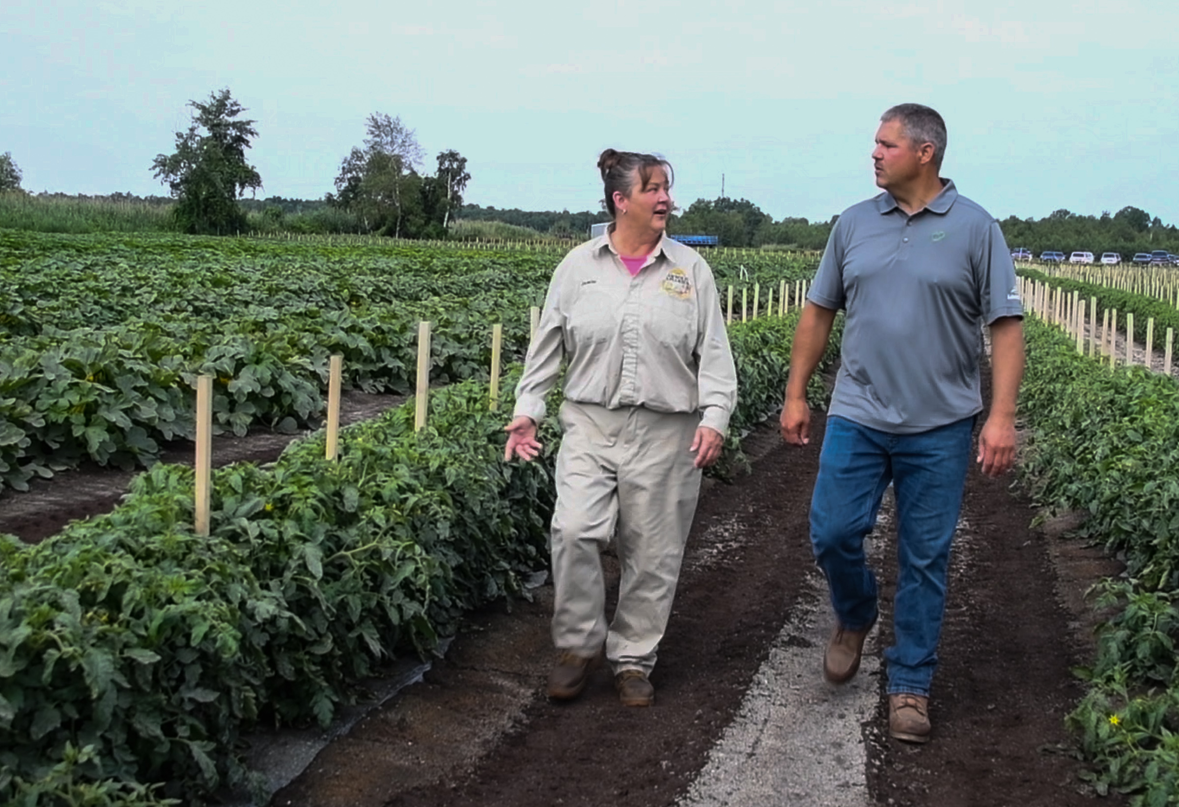 Beekeeper Jamie Ostrowski (left) and farmer Matt Jansen teamed up as the Bee Integrated principles spread to Michigan.